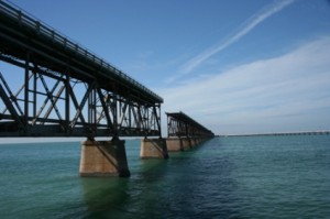 View of the Bahia Honda bridge stretching out far into the distance just over the water.