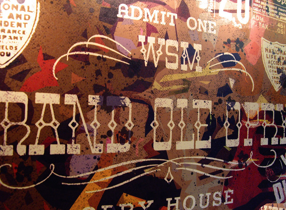 Photograph of an exhibit piece with a ticket reading Admit One WSM Grand Ole Opry.
