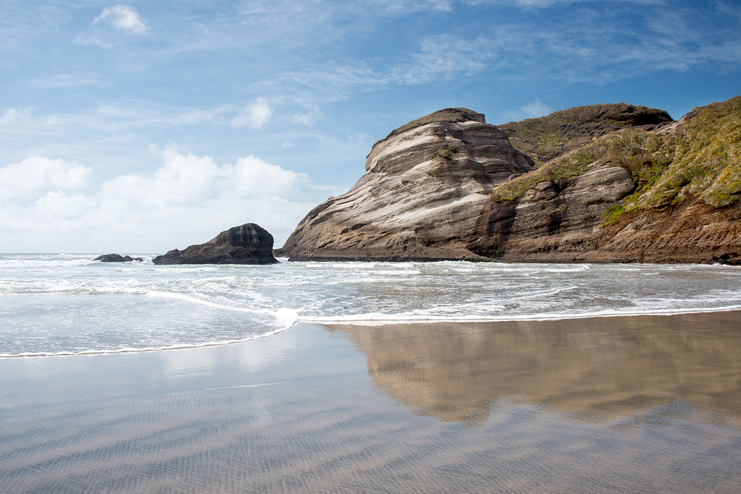 Look but don't touch: Wharariki Beach is ruggedly handsome but too stormy to surf or swim. Image by Andrea Schaffer / CC BY 2.0