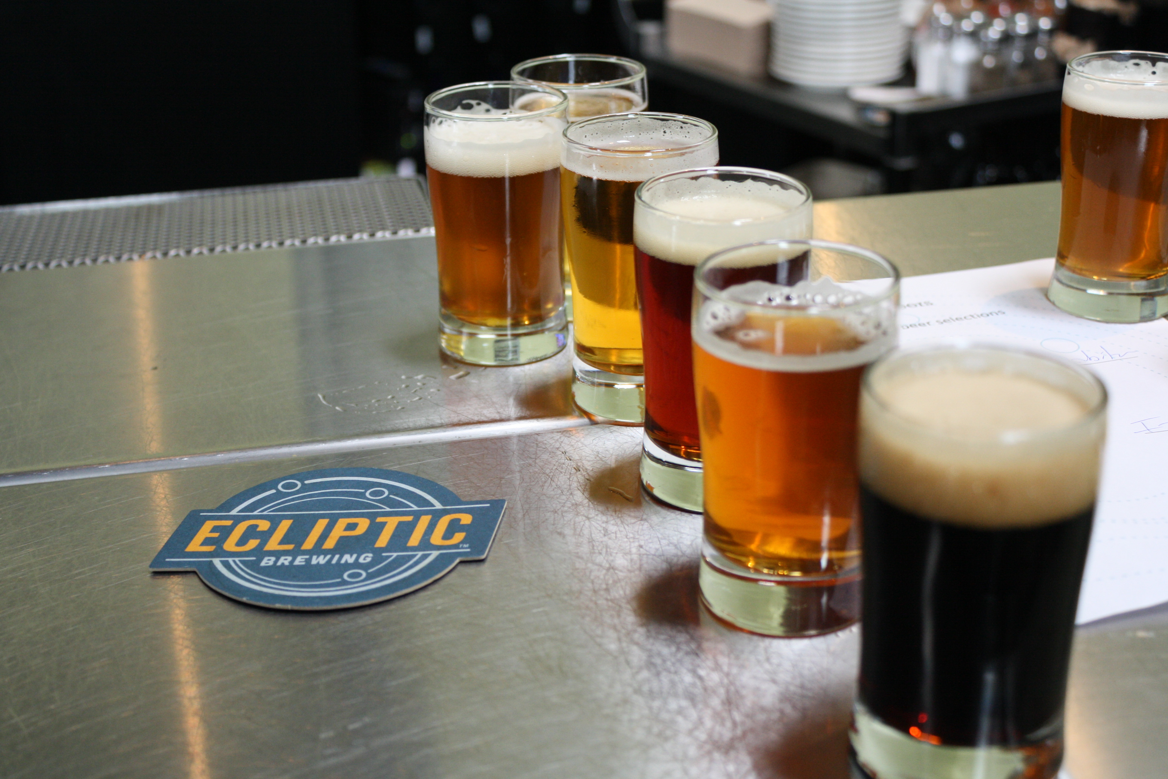 A flight of beers at astronomically good Ecliptic Brewing. Image by  / Lonely Planet