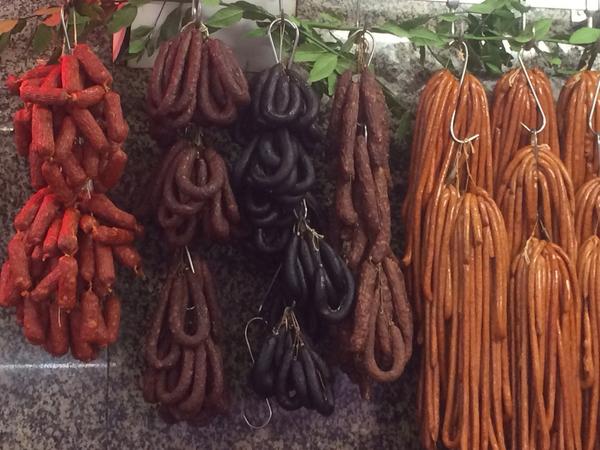 Sausages hanging in the Mercado do Bolhão. Image by Kerry Christiani / Lonely Planet