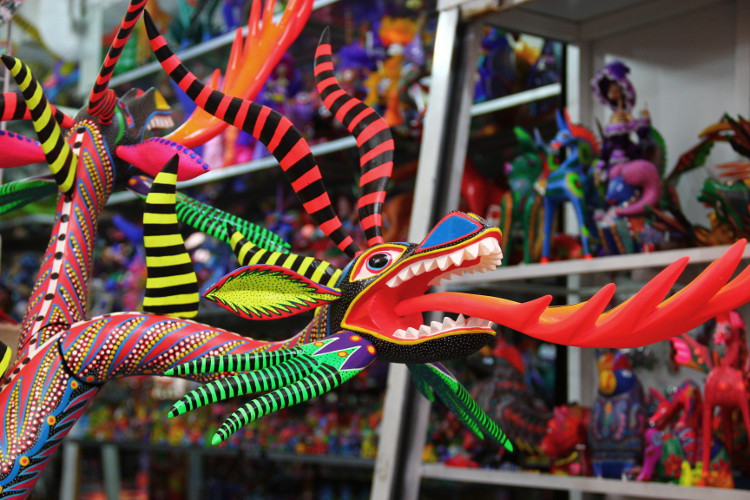 Alebrijes combine fantasy  creatures with vibrant colors. Image by Phillip Tang / Lonely Planet