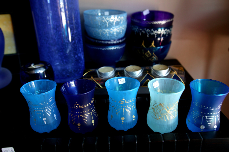 Hand-painted glassware sold on Rue de Liberte. Image by Lonely Planet / Lonely Planet Images / Getty