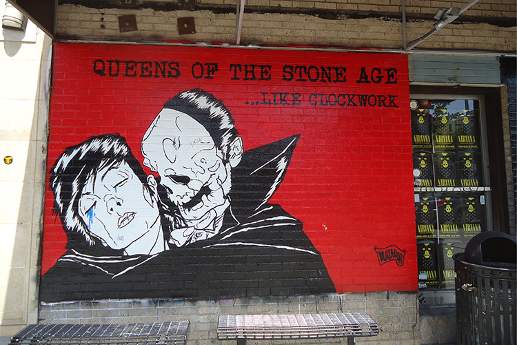 The Queens of the Stone Age mural outside Easy Street Records. Image by Brendan Sainsbury / Lonely Planet