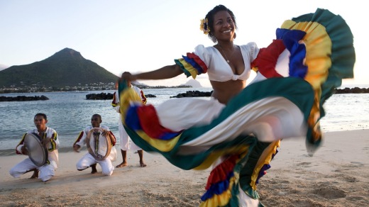 Segae dancer performs on a beach in Mauritius.