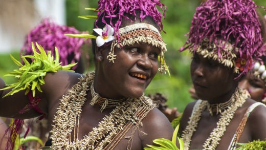 Villagers on Santa Ana Island perform  welcome dances for guests. Many have teeth dyed red through years of chewing ...