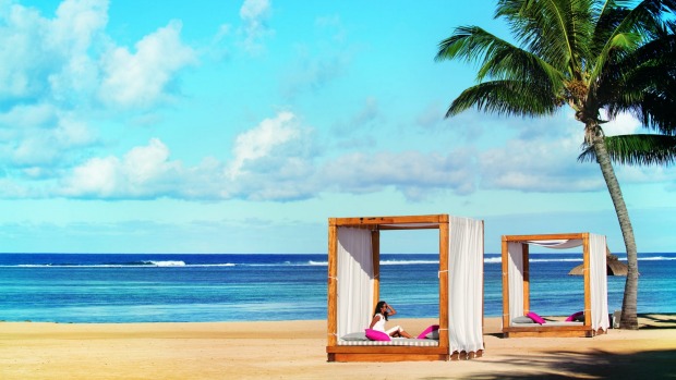 There's a <i>Sex and the City</i> vibe at the beach cabanas at Outrigger Mauritius Resort.