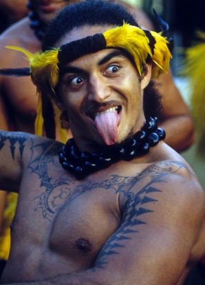 A Tahitian man with tattoos in today's hip-shaking dance routine known as 'tamure'.