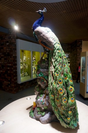 A magnificent ceramic peacock from the Wedgwood Collection stands 1.5 metres tall.
