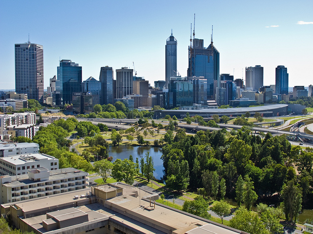 View of the Perth city skyline with a park in the foreground.