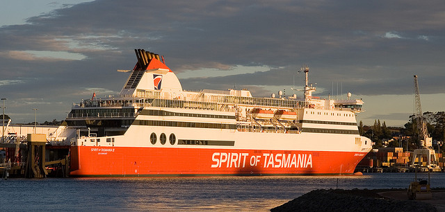 A red and white ferry with the name Spirit of Tasmania painted along the side.