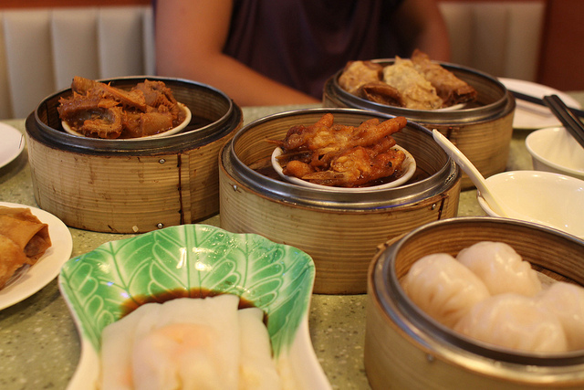 A series of dishes in steaming baskets similar.