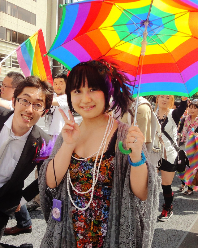 Rainbow flags and umbrellas at the Tokyo Pride Parade.