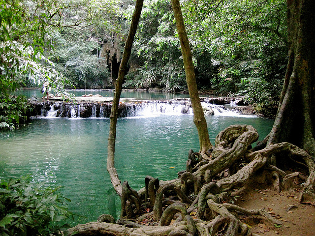 Photo of a river and waterfall in Tharnboke Koranee National Park in Thailand.