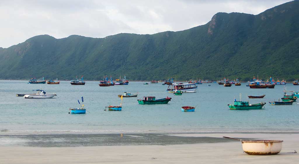 Fishing boats offshore from Con Dao. Photo © Dana Filek-Gibson.