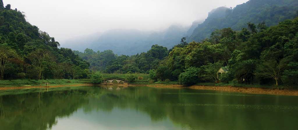 Misty mountains are the backdrop for Cuc Phuong National Park. Photo © Dana Filek-Gibson.