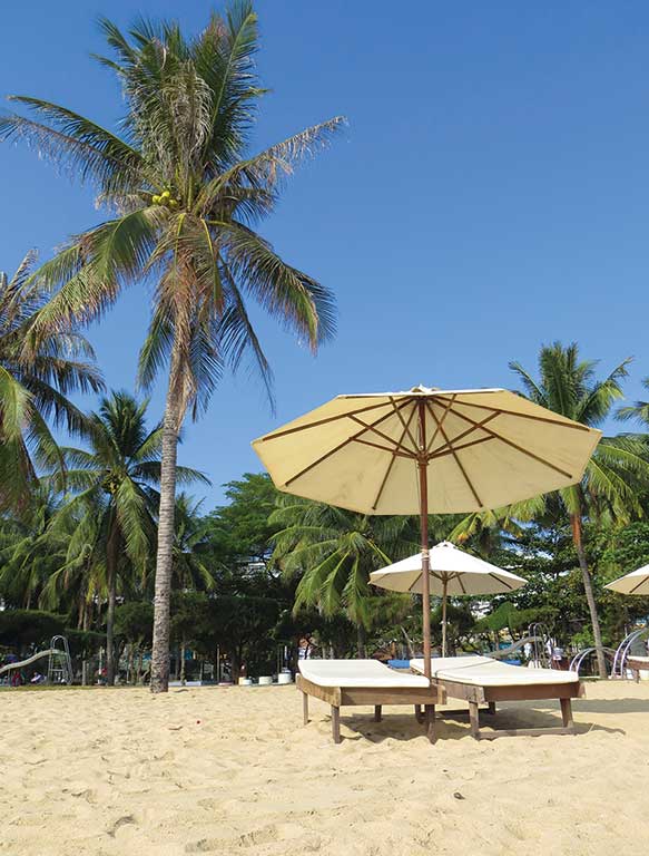 Sun beds on Nha Trang Beach. Photo © Dana Filek-Gibson.