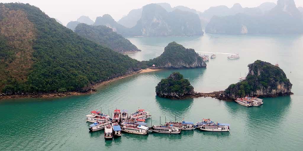 Ha Long Bay is an enigmatic maze of blue-green waters. Photo © Dana Filek-Gibson.