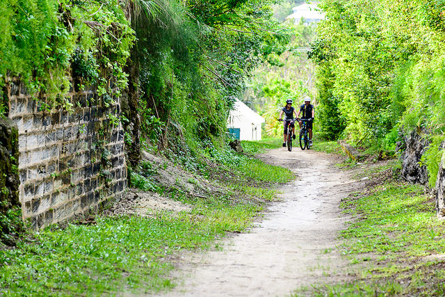A pair of cyclists following the Railway Trail in Bermuda.