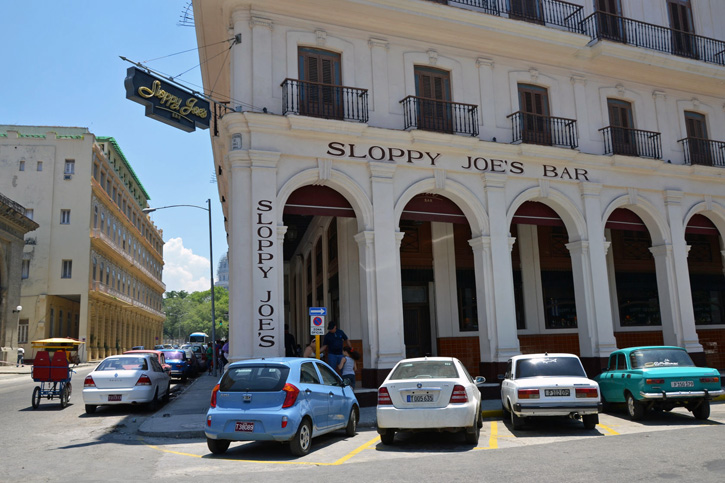 Cars parked outside the historic Sloppy Joe's Bar in Havana, Cuba.