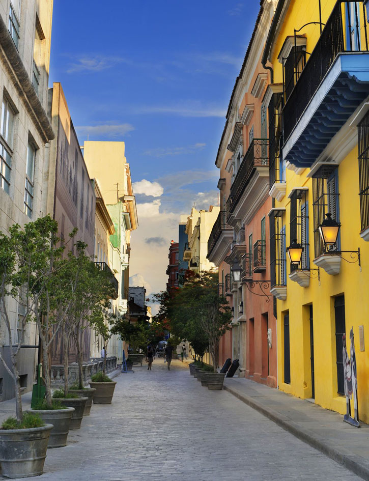A view of an Old Havana street with typical colonial buildings.