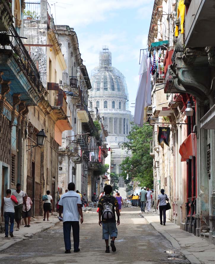 A street in Habana Vieja, Havana, Cuba, leads to the Capitol building, which is undergoing a facelift.