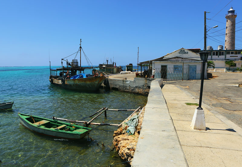 Fishing boats at the waterfront in Cabo Cruz, Cuba.