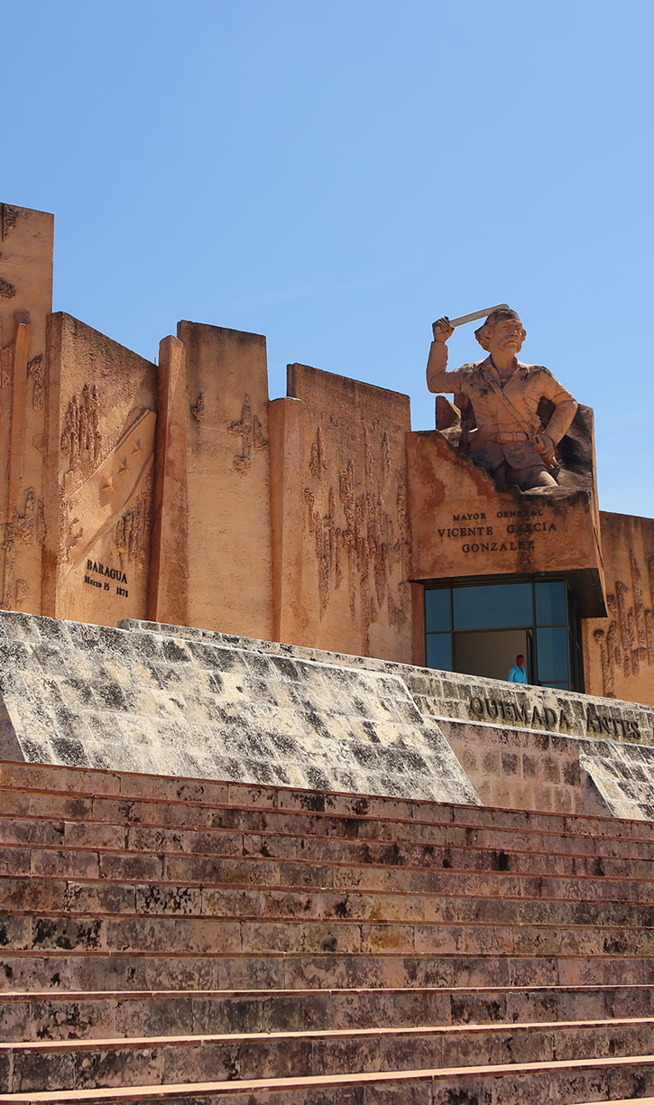 A large concrete monument dedicated to Mayor General Vicente García González in Las Tunas, Cuba.