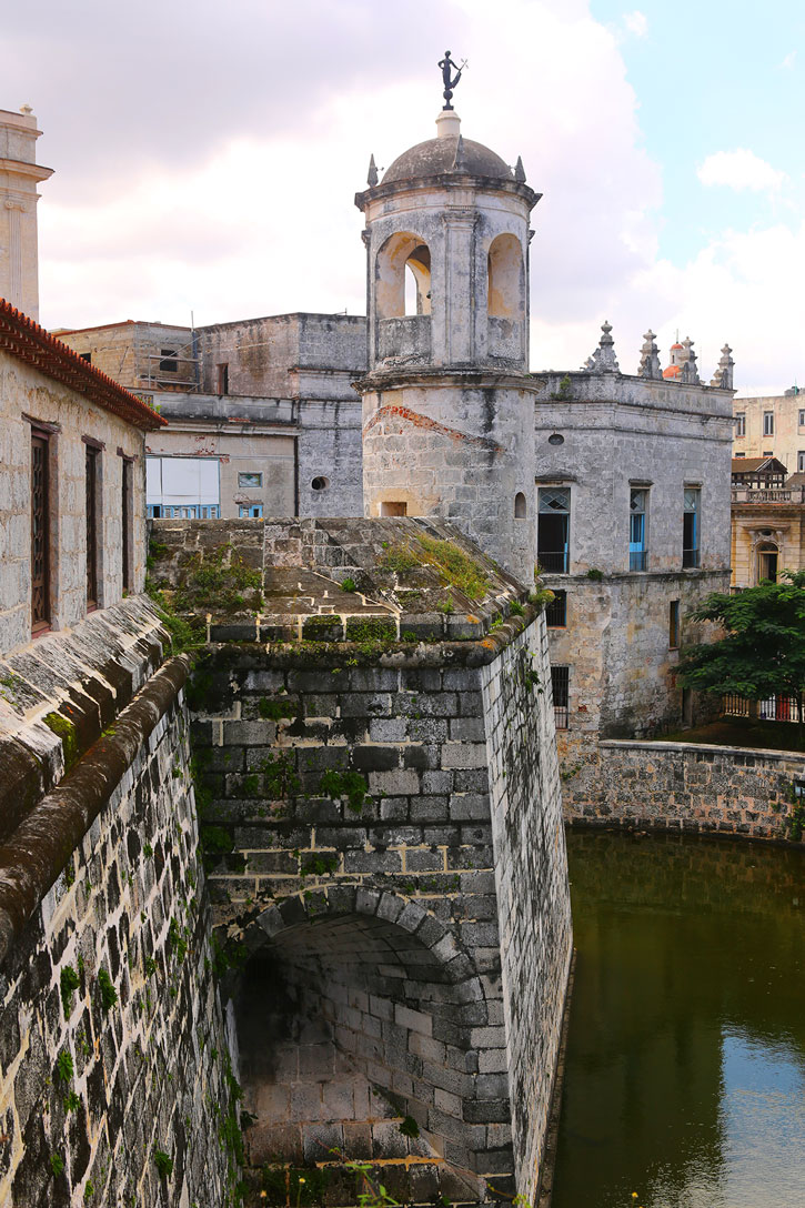 The stone walls of the Castillo de las Armas on the water in Havana.