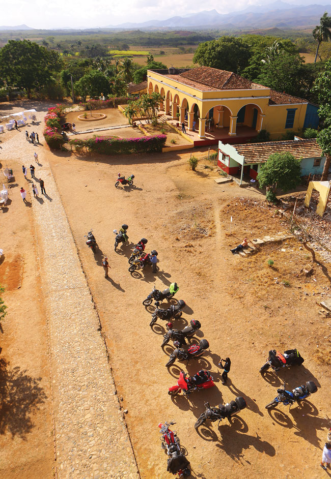 View from above at a row of motorcycles parked at Hacienda Iznaga in Cuba.