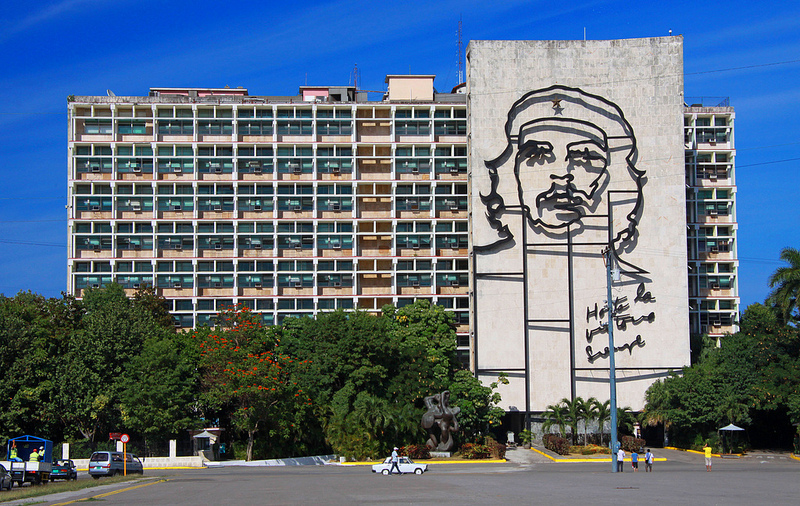 Affixed to the side of a seven-story office building, wrought metal forms the outlines of Che Guevara's portrait.