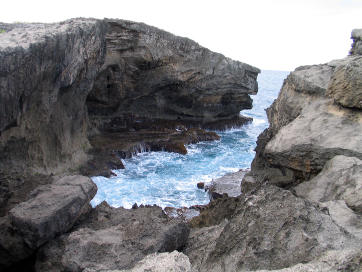 Ocean waves meet petrified sand dunes at Cueva del Indio, on Puerto Rico's northern shore.