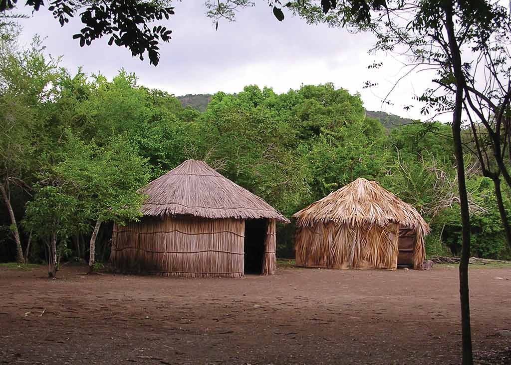 Re-created Taíno bohio dwellings at Centro Ceremonial Indígena de Tibes. Photo © Suzanne Van Atten.
