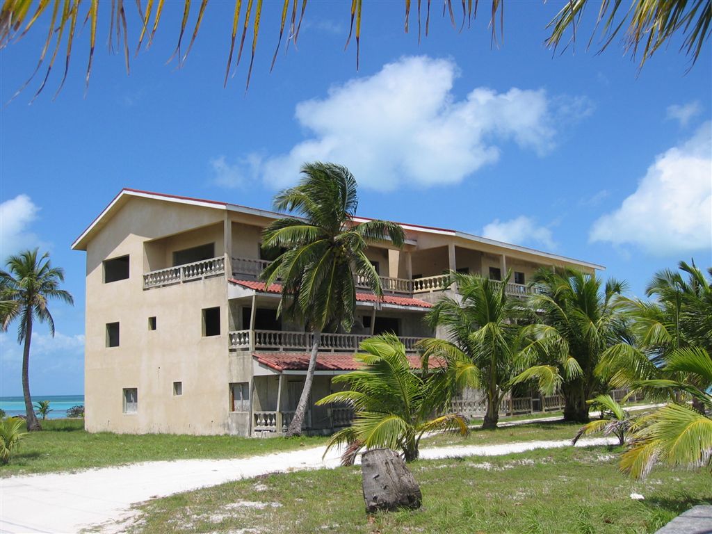 A multi-story concrete building at the seaside.