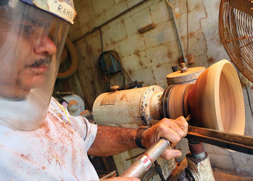 Shaping a bowl on a lathe at Barry Biesanz Woodworks. Photo © Christopher P. Baker.