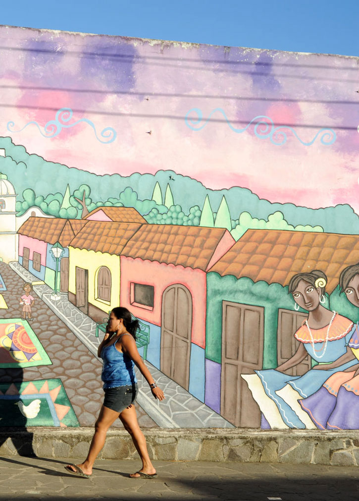 Colorful murals adorn homes in Ataco, El Salvador.