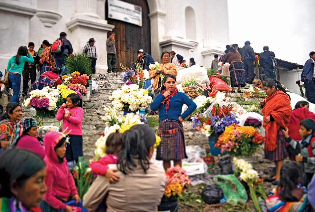 Flowers on display in the Chichicastenango market. Photo © Al Argueta.