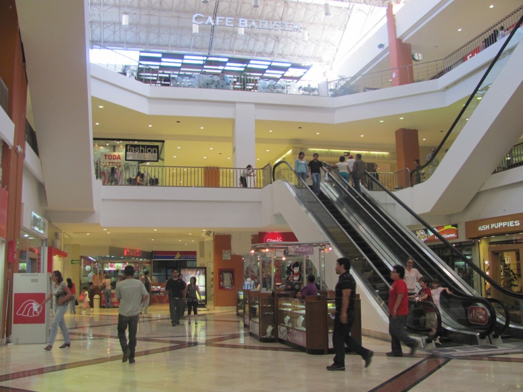 Interior view of a mall with glossy modern architecture.