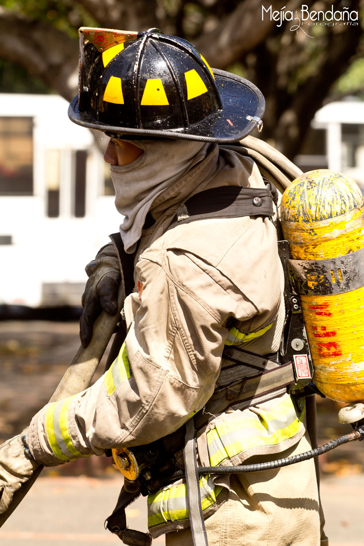 A firefighter in gear with an oxygen tank in Managua.