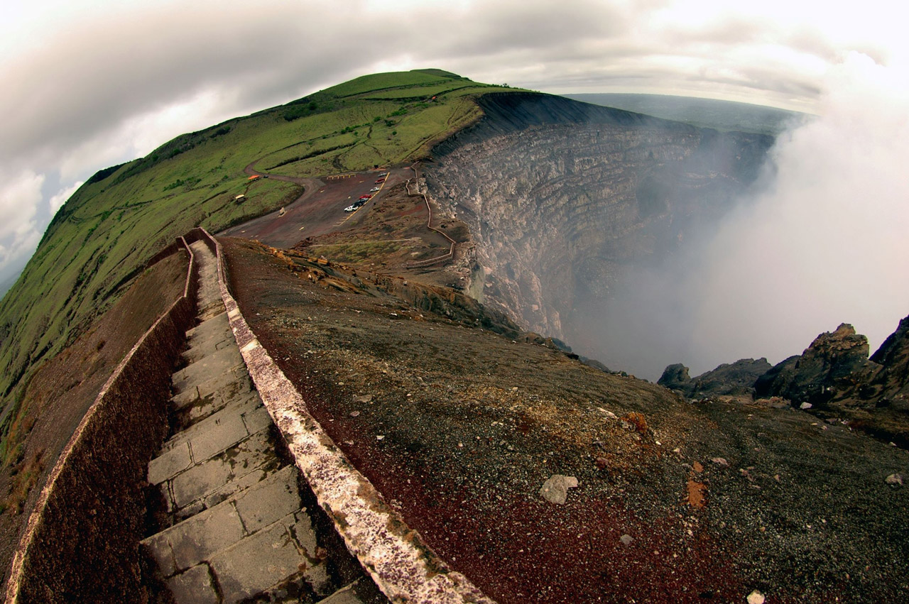 View from a stone path at the edge of the volcano's steaming crater.