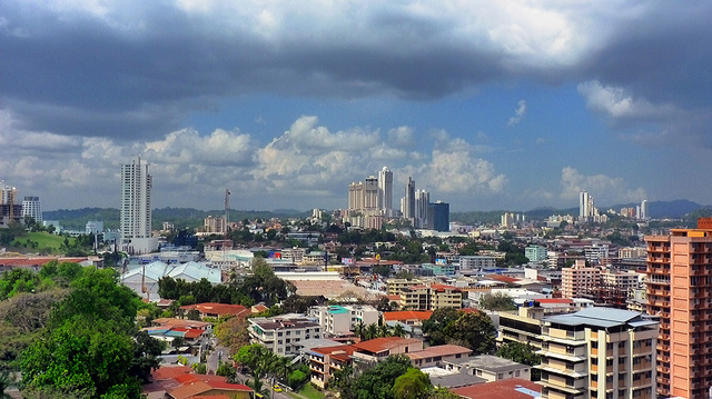 View across the rooftops of the Zona Libre de Colón district full of multi-story buildings.