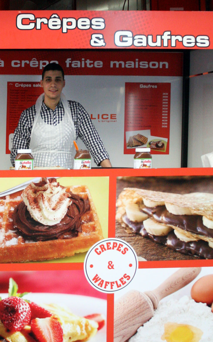 A food stand selling crêpes and waffles.