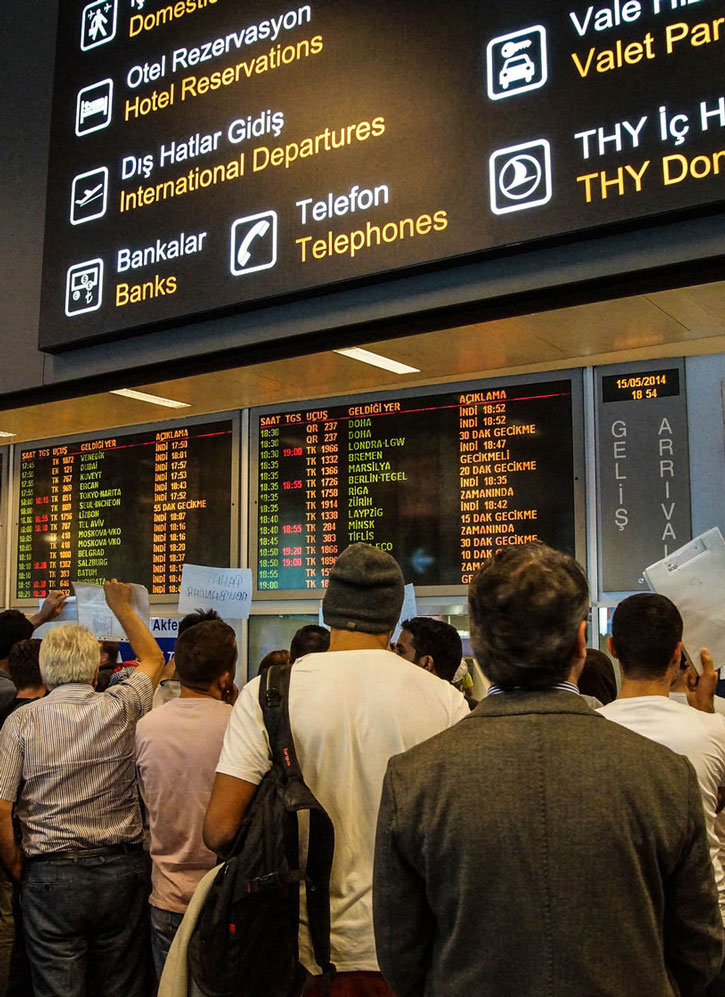 People waiting outside customs at the arrival gate in Instanbul's airport.