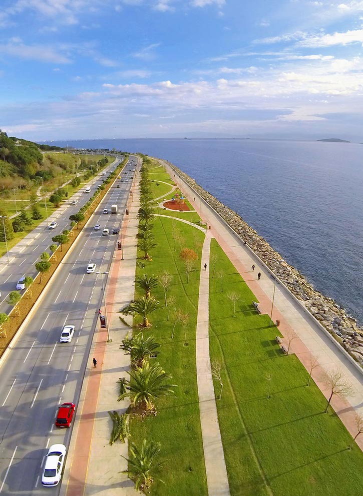 Cars travel along a divided road along the coast of the Marmara Sea.