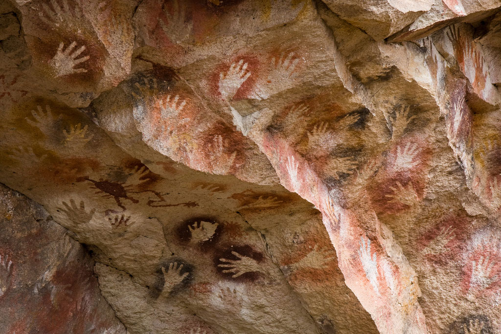Ancient art showing handprints at Cueva de las Manos in Argentina