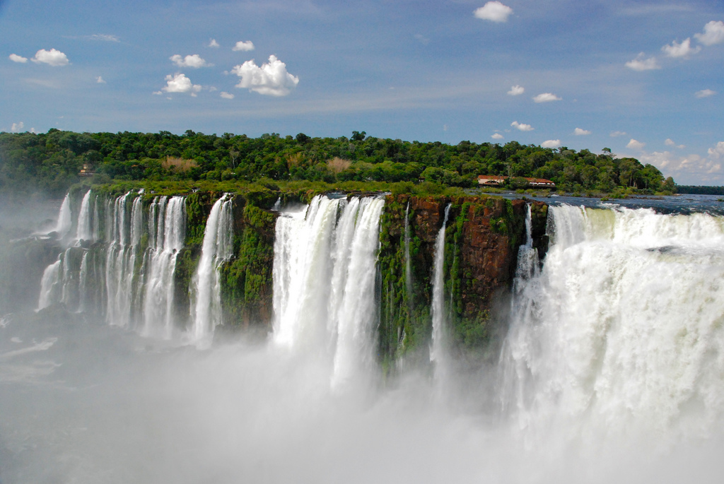 Water pours off the vast ledge of the falls.