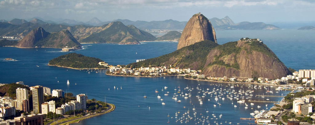View down into Guanabara Bay with the round peak of Sugarloaf Mountain rising from the peninsula.