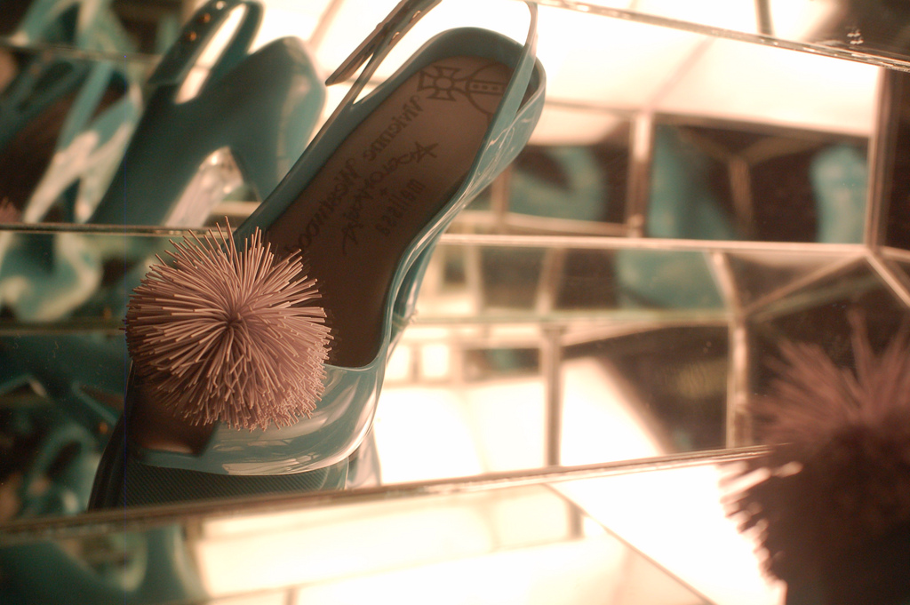 Seaform green open-toe heels with a playful jelly pink pom-pom.