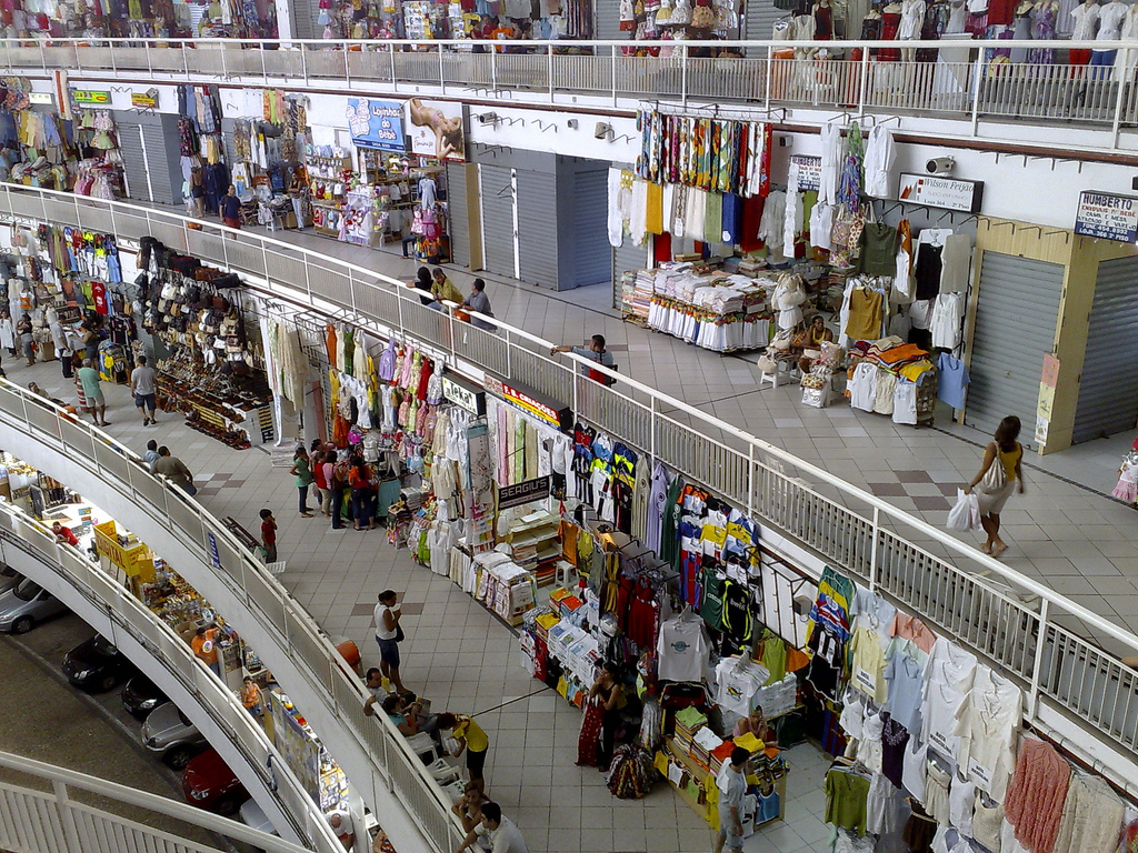 Multi-level shopping center filled with stalls.