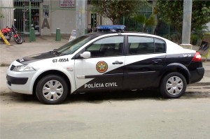 A Brazilian police car marked Policia Civil parked on the street.